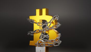Golden,Bitcoin,Sign,Being,Locked,By,A,Chain,On,Dark